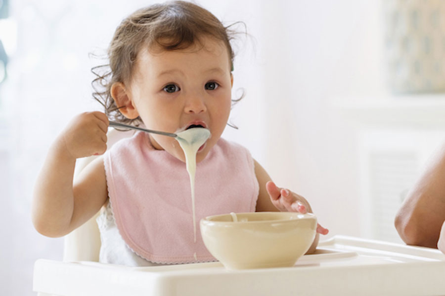 Baby eating cereal
